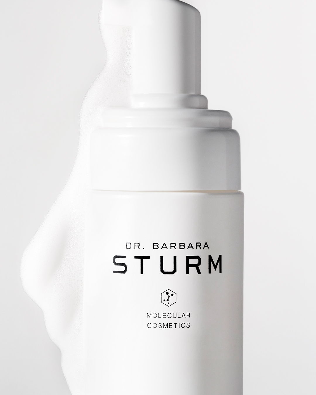 White cosmetic bottle with Dr. Barbara Sturm branding and pump dispenser.